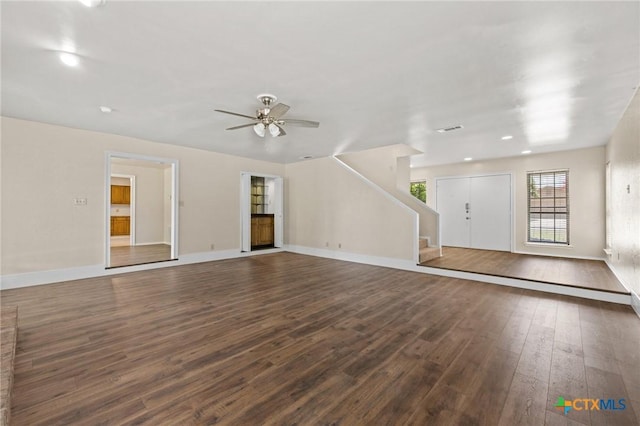 601 Pondview Dr, Killeen, TX 76542 - unfurnished living room with dark wood-type flooring, stairway, a ceiling fan, and recessed lighting