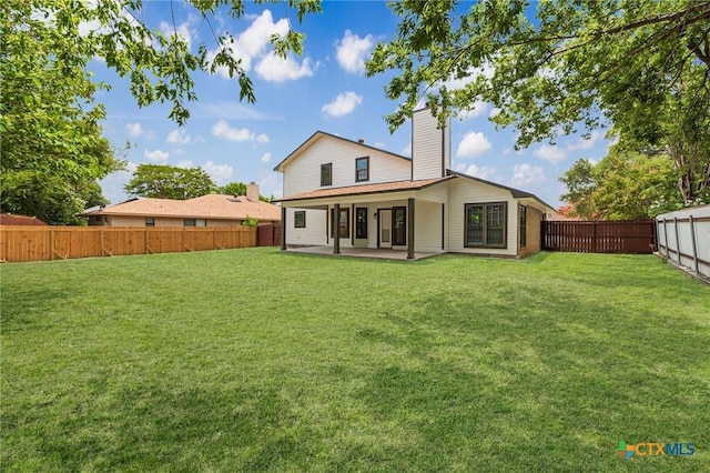601 Pondview Dr, Killeen, TX 76542 - rear view of house featuring a patio area, a fenced backyard, and a chimney