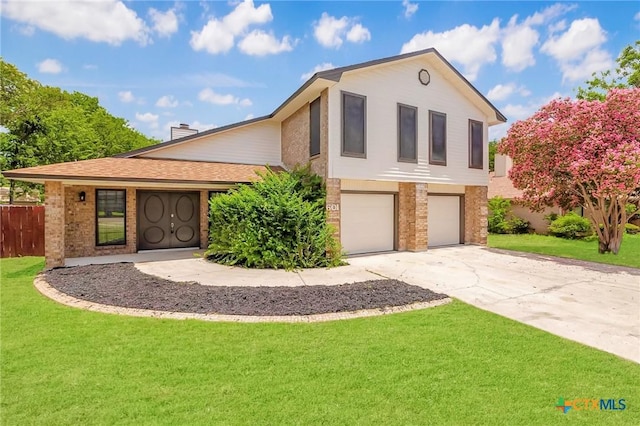 601 Pondview Dr, Killeen, TX 76542 - view of front of house with a garage, brick siding, and concrete driveway
