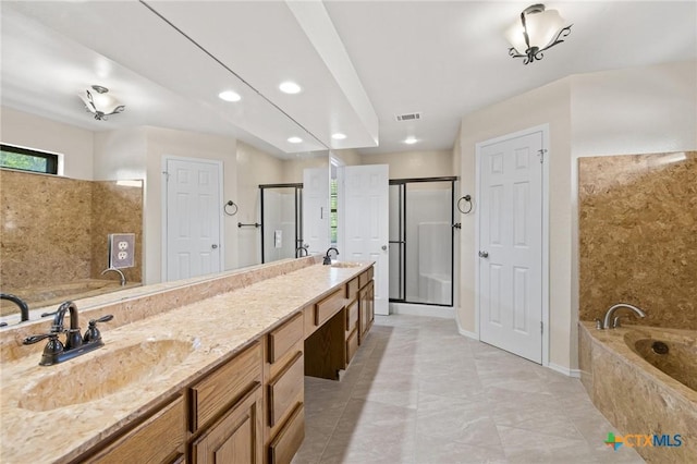 601 Pondview Dr, Killeen, TX 76542 - full bathroom with healthy amount of natural light, a bath, double vanity, and recessed lighting