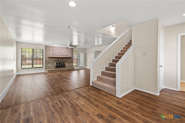 601 Pondview Dr, Killeen, TX 76542 - unfurnished living room featuring wood finished floors, a fireplace, a ceiling fan, stairway, and recessed lighting
