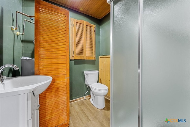 3268 Eagle Point W Ave, Belton, TX 76513 - bathroom with wood finished floors, a shower stall, toilet, and vanity