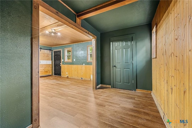 3268 Eagle Point W Ave, Belton, TX 76513 - corridor with wood walls, wood finished floors, and baseboards