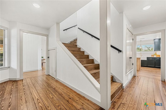 3268 Eagle Point W Ave, Belton, TX 76513 - staircase featuring hardwood / wood-style floors, baseboards, and recessed lighting