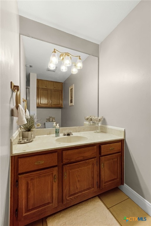 bathroom with tile patterned flooring and vanity