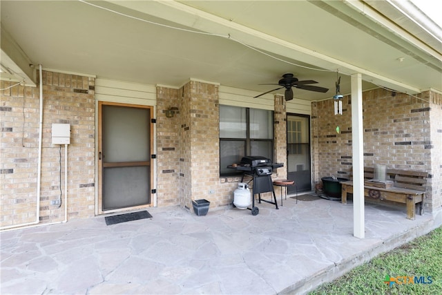 view of patio / terrace with area for grilling and ceiling fan