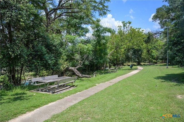 surrounding community with a lawn