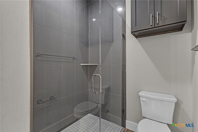 2143 Blackhawk Loop, Belton, TX 76513 - bathroom featuring toilet and a shower stall