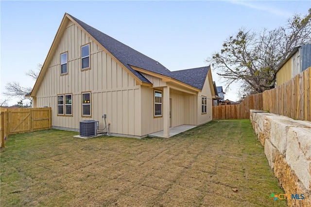 2143 Blackhawk Loop, Belton, TX 76513 - back of property with board and batten siding, a shingled roof, and a fenced backyard