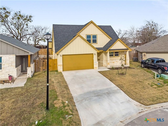 view of front of property featuring a garage and a front yard