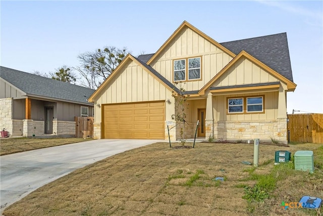 2143 Blackhawk Loop, Belton, TX 76513 - view of front facade with stone siding, board and batten siding, a shingled roof, and concrete driveway