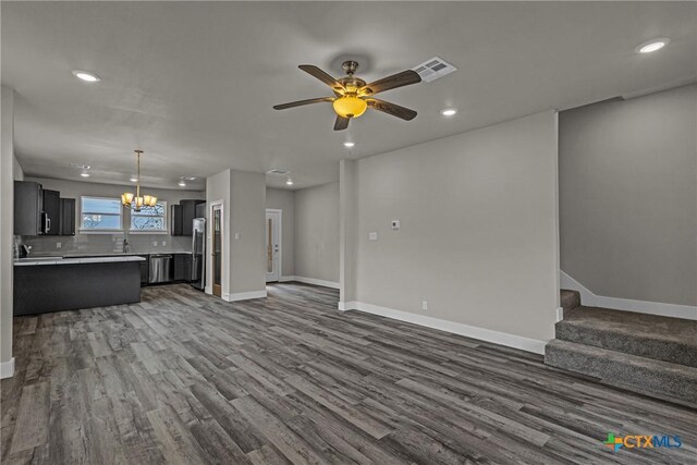 interior space featuring hardwood / wood-style floors and stainless steel fridge