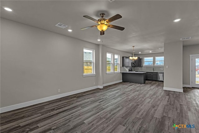 interior space with ceiling fan and dark hardwood / wood-style floors