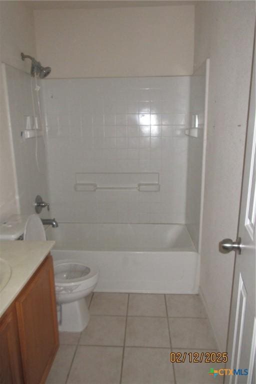 bathroom with toilet, bathing tub / shower combination, vanity, and tile patterned floors