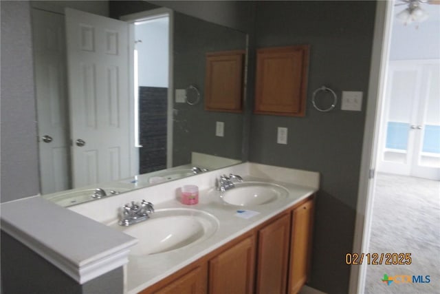 bathroom featuring double vanity and a sink