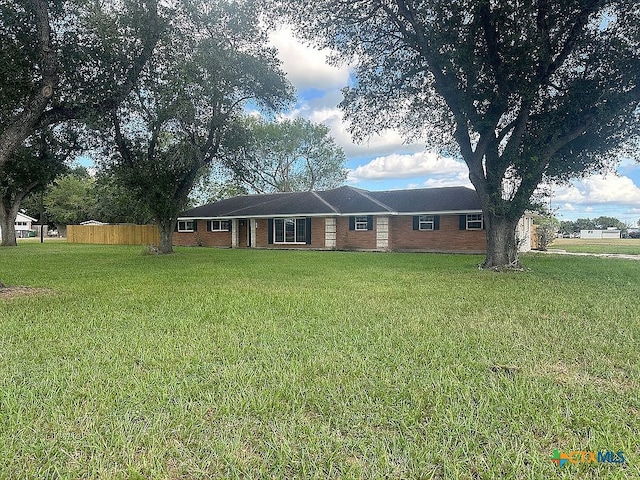 ranch-style house with a front lawn