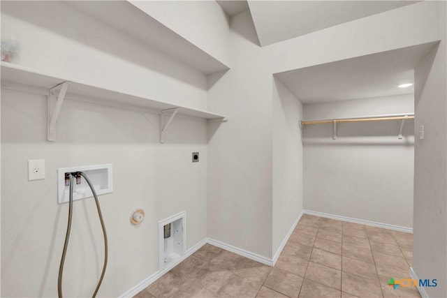 6106 Amelia Earhart Blvd, Killeen, TX 76543 - washroom featuring washer hookup, hookup for an electric dryer, baseboards, gas dryer hookup, and tile patterned floors