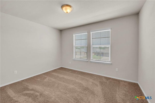 6106 Amelia Earhart Blvd, Killeen, TX 76543 - carpeted spare room with baseboards