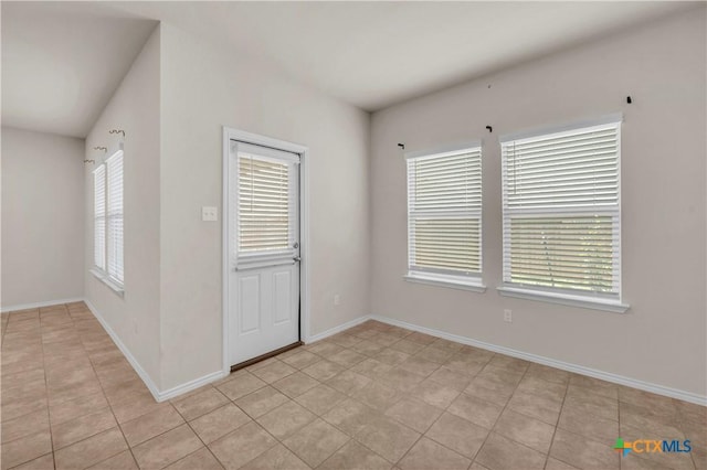 6106 Amelia Earhart Blvd, Killeen, TX 76543 - empty room with baseboards and light tile patterned floors