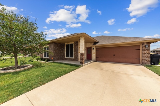 ranch-style home with a garage and a front yard