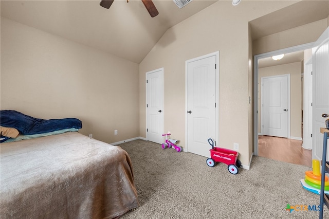 carpeted bedroom featuring vaulted ceiling and ceiling fan