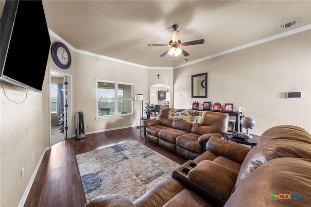 living room featuring ceiling fan, dark hardwood / wood-style floors, and crown molding