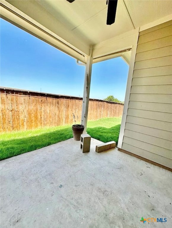 view of patio featuring ceiling fan