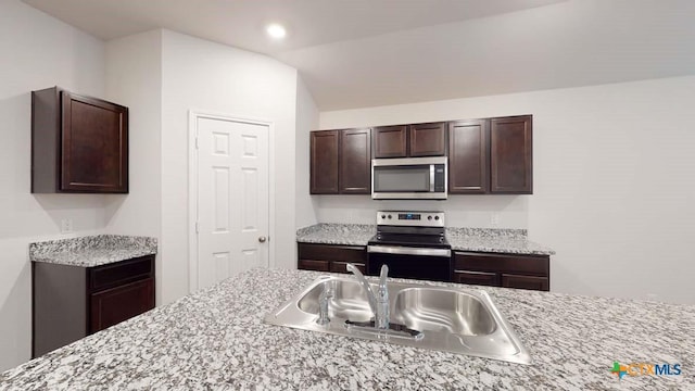 625 Eaton Dr, Temple, TX 76504 - kitchen with stainless steel appliances, dark brown cabinets, and recessed lighting