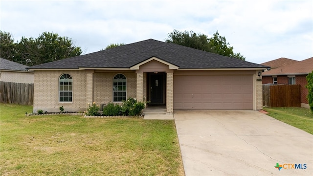 5300 Two Step Pl, Killeen, TX 76542 - ranch-style home featuring brick siding, a garage, concrete driveway, and a shingled roof