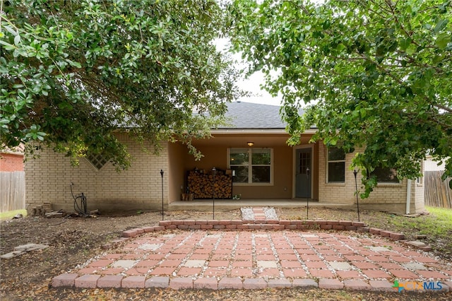 5300 Two Step Pl, Killeen, TX 76542 - back of property featuring brick siding, a patio, and a shingled roof