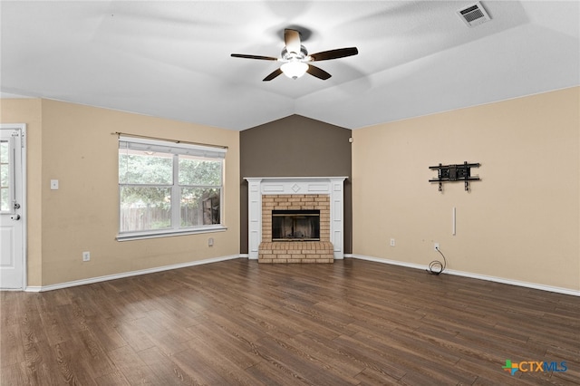 5300 Two Step Pl, Killeen, TX 76542 - unfurnished living room featuring a ceiling fan, dark wood-type flooring, a brick fireplace, baseboards, and vaulted ceiling