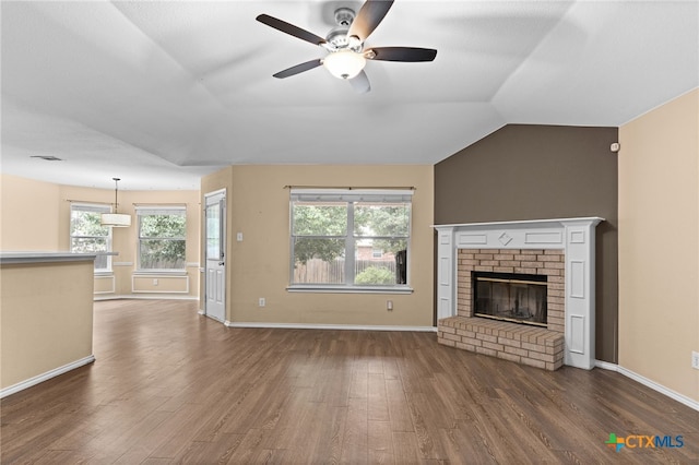 5300 Two Step Pl, Killeen, TX 76542 - unfurnished living room featuring wood finished floors, a ceiling fan, healthy amount of natural light, baseboards, and vaulted ceiling