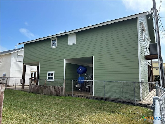 back of property featuring a lawn and fence private yard