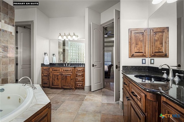 111 Western Oaks, New Braunfels, TX 78132 - bathroom with a jetted tub, tile patterned flooring, a sink, and two vanities