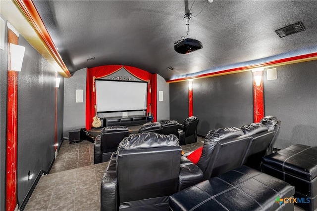 111 Western Oaks, New Braunfels, TX 78132 - home theater room with vaulted ceiling, a textured ceiling, baseboards, visible vents, and a textured wall