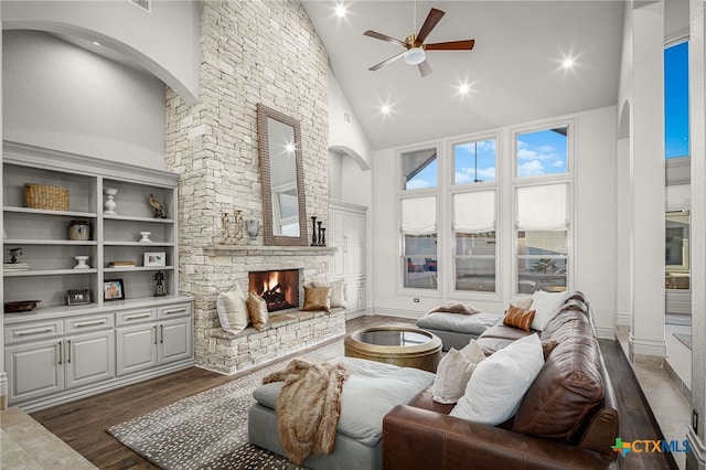 111 Western Oaks, New Braunfels, TX 78132 - living area with high vaulted ceiling, recessed lighting, a ceiling fan, a stone fireplace, and dark wood-style floors