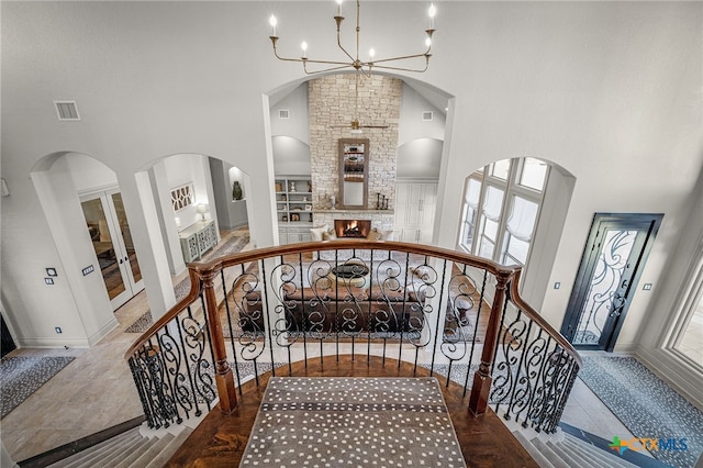 111 Western Oaks, New Braunfels, TX 78132 - stairway featuring an inviting chandelier, a towering ceiling, and visible vents