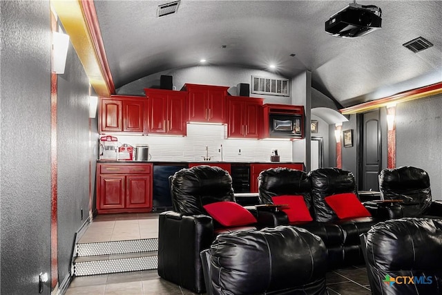 111 Western Oaks, New Braunfels, TX 78132 - cinema with visible vents, a sink, and vaulted ceiling