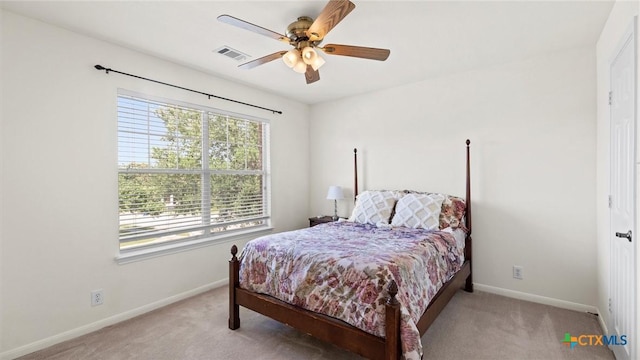 bedroom with carpet flooring, baseboards, and ceiling fan