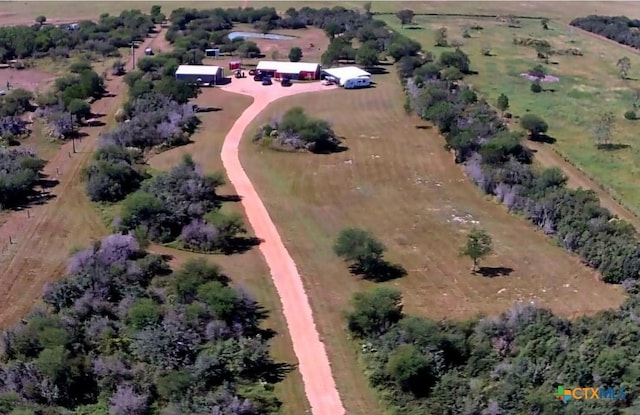 birds eye view of property with a rural view