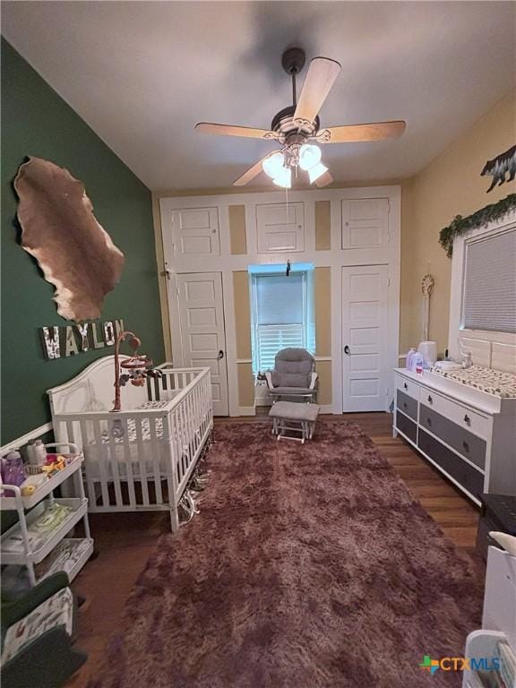 bedroom with wood finished floors and a ceiling fan