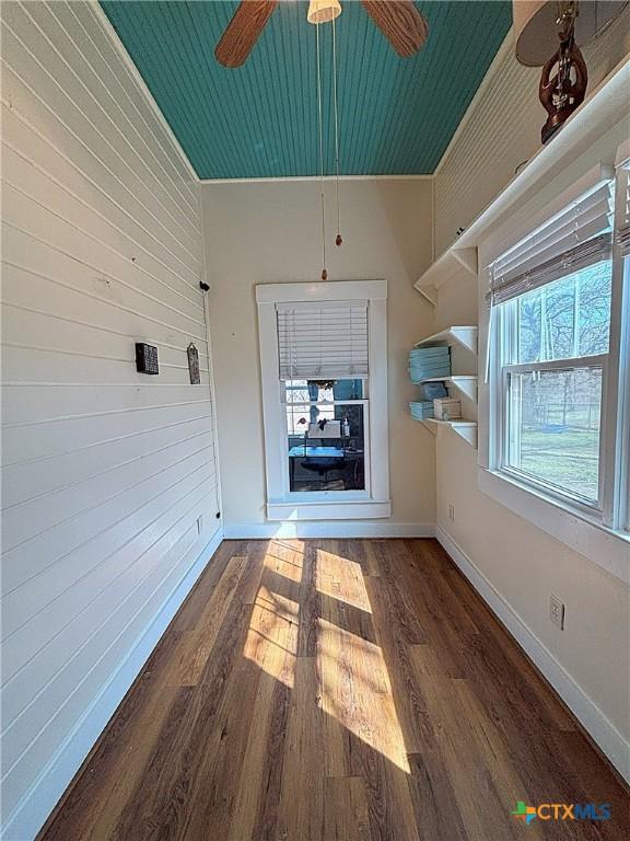 interior space featuring ceiling fan