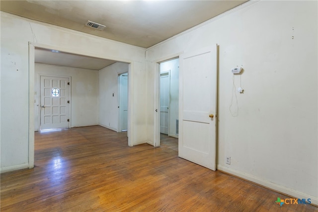 spare room with dark wood-type flooring