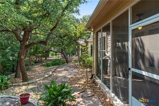 view of yard featuring a sunroom