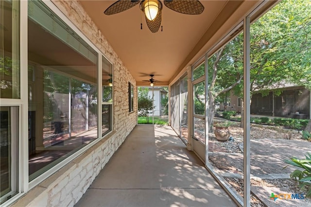 view of patio featuring ceiling fan