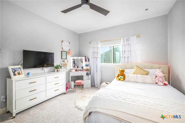 bedroom with a ceiling fan and light carpet