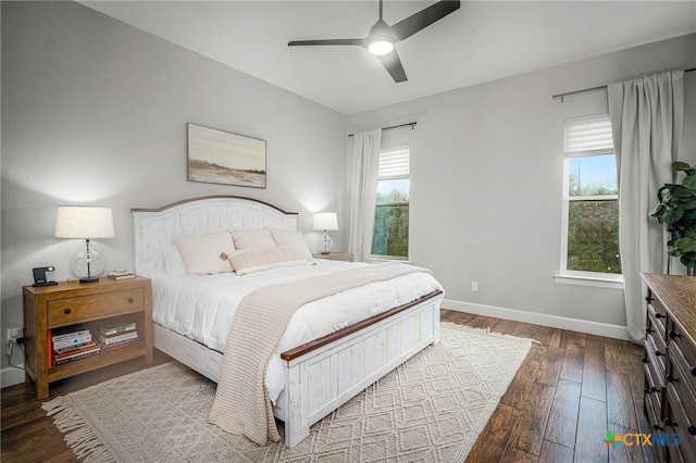 bedroom with a ceiling fan, baseboards, and hardwood / wood-style floors