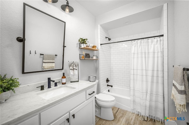 full bath with toilet, vanity, wood finished floors, and shower / tub combo with curtain