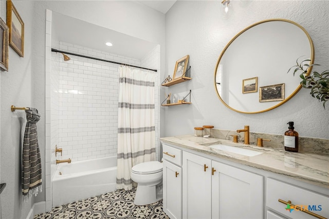 full bath featuring shower / bath combo with shower curtain, vanity, toilet, and tile patterned floors