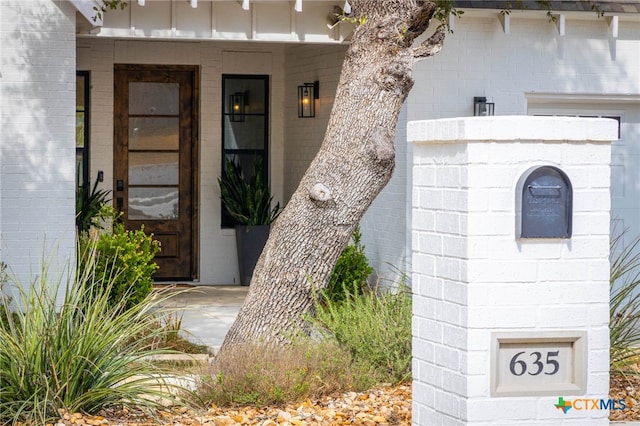 entrance to property with brick siding